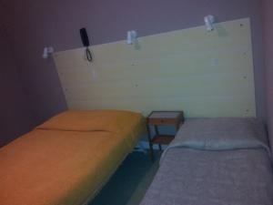 سرير أو أسرّة في غرفة في فندق دو تيراجه