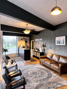 a living room with a couch and a table at Timbers INN and Suites in Ashland