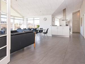 a living room with a couch and a table at Holiday home Vejle in Vejle