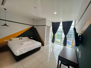 Postel nebo postele na pokoji v ubytování Smile Hotel Klang Bukit Tinggi