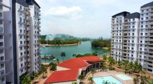 a view of a river from between two buildings at Gharoda PD Homestay CView in Kampong Baharu