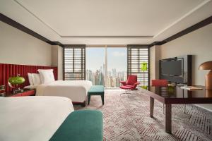 Postel nebo postele na pokoji v ubytování Regent Shanghai Pudong