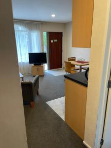 a room with a kitchen and a living room at BPS apartment 3 in Taupo