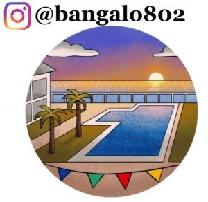 a sticker with a picture of a beach and a pool at Excelente Bangalô/duplex em Jacumã - PB in Conde