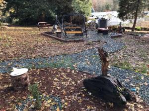 a park with a playground with a swing at Spacious upstairs studio with kitchenette & 1 bath in Grants Pass