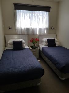Postel nebo postele na pokoji v ubytování Waitahanui Lodge