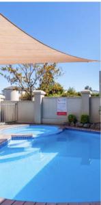 a large blue swimming pool with at BPS apartment 3 in Taupo
