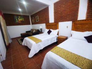 Voodi või voodid majutusasutuse Hotel Boutique Casona Mashei toas