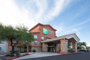 a hotel with a sign on the front of it at Holiday Inn Express & Suites Tucson, an IHG Hotel in Tucson