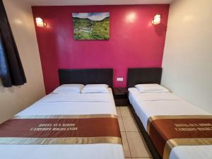 Postel nebo postele na pokoji v ubytování Hotel Sun Birds