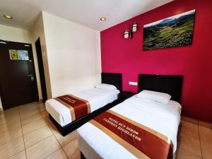 Postel nebo postele na pokoji v ubytování Hotel Sun Birds