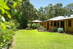 a house with a yard in front of it at Mansfield Retreat - In Town - Margaret River in Margaret River Town