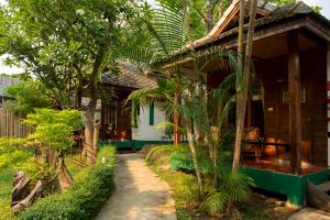 a small house with a pathway leading to it at Mad Monkey Pai in Pai