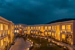 a building with a courtyard at night at Tree of Life Vantara Resort & Spa in Udaipur