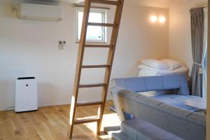 Postel nebo postele na pokoji v ubytování Beach SPA TSUDA 1 Uno