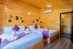 Postel nebo postele na pokoji v ubytování Moly Resort