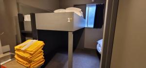 Postel nebo postele na pokoji v ubytování Rhodes Otsuka Hotel