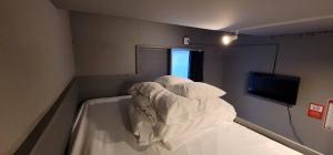 Postel nebo postele na pokoji v ubytování Rhodes Otsuka Hotel