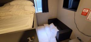 Postel nebo postele na pokoji v ubytování Rhodes Otsuka Hotel