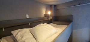 Postel nebo postele na pokoji v ubytování Rhodes Otsuka Hotel