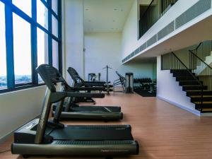 a row of treadmills in a gym with stairs at The Hub SS2 - Studio Suite Room in Kuala Lumpur