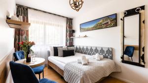 Posteľ alebo postele v izbe v ubytovaní Aparthotel Delta Zakopane