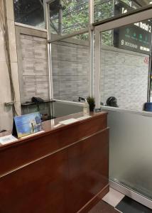 an office with a reception desk and a window at Hotel Serasi 2 in Tangerang