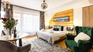 Posteľ alebo postele v izbe v ubytovaní Aparthotel Delta Zakopane