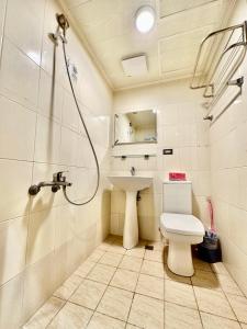 a bathroom with a shower and a toilet and a sink at 小鹿之家 in Taichung +40 photos