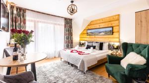 Posteľ alebo postele v izbe v ubytovaní Aparthotel Delta Zakopane