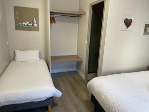 Postel nebo postele na pokoji v ubytování Hôtel Oxo