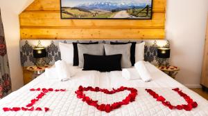Posteľ alebo postele v izbe v ubytovaní Aparthotel Delta Zakopane