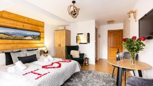 Posteľ alebo postele v izbe v ubytovaní Aparthotel Delta Zakopane