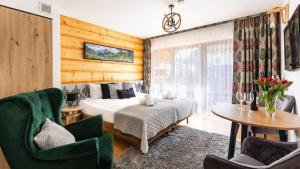 Posteľ alebo postele v izbe v ubytovaní Aparthotel Delta Zakopane