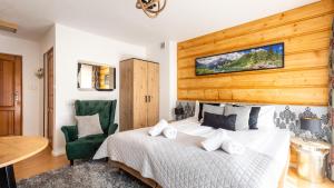 Posteľ alebo postele v izbe v ubytovaní Aparthotel Delta Zakopane