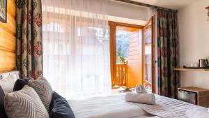 Posteľ alebo postele v izbe v ubytovaní Aparthotel Delta Zakopane
