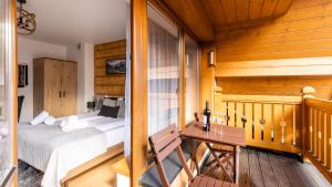 Posteľ alebo postele v izbe v ubytovaní Aparthotel Delta Zakopane