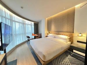 Postelja oz. postelje v sobi nastanitve Four Points by Sheraton Chongqing, Yongchuan
