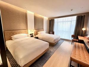 Postelja oz. postelje v sobi nastanitve Four Points by Sheraton Chongqing, Yongchuan