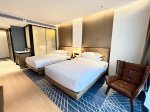 Postelja oz. postelje v sobi nastanitve Four Points by Sheraton Chongqing, Yongchuan