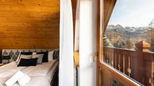 Posteľ alebo postele v izbe v ubytovaní Aparthotel Delta Zakopane