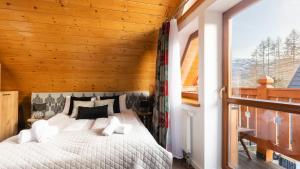 Posteľ alebo postele v izbe v ubytovaní Aparthotel Delta Zakopane