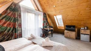 Posteľ alebo postele v izbe v ubytovaní Aparthotel Delta Zakopane