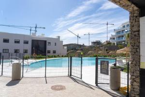 Bazén v ubytovaní Flat Deluxe&Pool sea view Higueron West alebo v jeho blízkosti