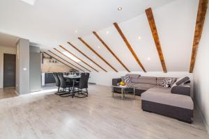 a living room with a couch and a table at Villa Gabi in Pridraga