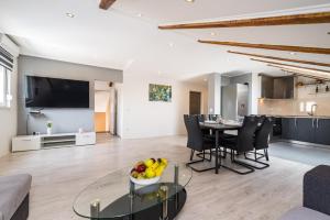 a living room with a table with a bowl of fruit at Villa Gabi in Pridraga
