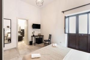 Μια τηλεόραση ή/και κέντρο ψυχαγωγίας στο Pomillo Rooms