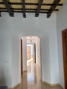 an empty hallway with white walls and a ceiling at Conil Homes V Apartments in Conil de la Frontera +18 photos