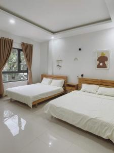 Postel nebo postele na pokoji v ubytování À Ơi Home - Venuestay