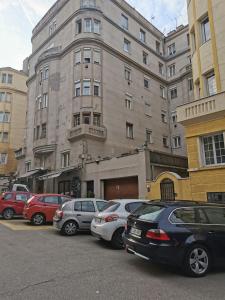 a group of cars parked in front of a building at Liberty Bridge Zenta in Budapest
